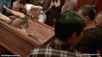 Slut in wooden glass box public fucked