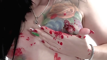 Tattooed babe Marie Bossette covers herself in hot wax