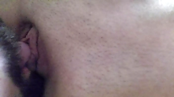 licking her clit with tongue flicking her bean