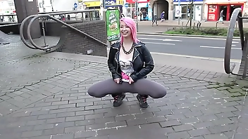 Beautiful and very slutty slut shows her ass in public while pissing between her legs
