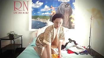 Lady changes her underwear, gracefully showing her charms. Part 1