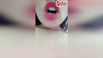 Amateur girl plays with her Asian pussy and pees