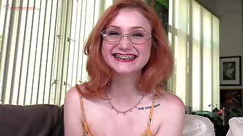 Watch the braces as redhead cute girl Scarlet Skies sucks dick!