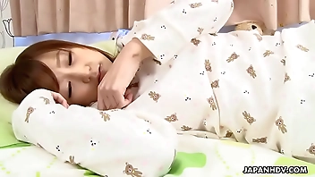 Cute Asian teen masturbates to an orgasm in her bed