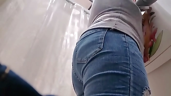 Your slutty Italian tries on jeans while wearing a butt plug in her ass