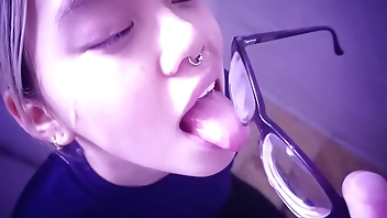 An Asian Slut Waits For Her Master; She Licks The Cum Off Her Glasses. Full Video On SabelArsene.com