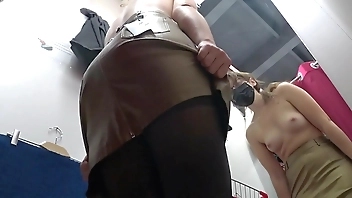Voyeur peeks under her skirt in public. And with a hidden camera in a fitting room spies on a girl with a juicy ass in nylon tights. Foot fetish.