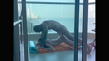 On a balcony in Cartagena, a young student gets her pretty little ass filled!