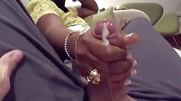 Desi woman gives young man handjob on train