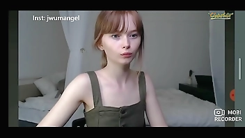 Cute innocent teen teasing in webcam