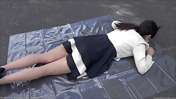 Woman with her hands behind