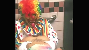 Girl rides clown in bathroom stall
